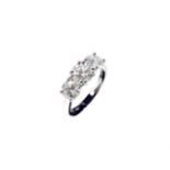 A platinum three stone diamond ring, set with three individually IGR certificated diamonds, the
