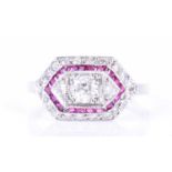 An 18ct white gold, diamond, and ruby ringin the Art Deco taste, the angled mount centred with a