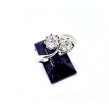 A platinum two stone diamond ring, two claw set  old cushion cut diamonds of K/L colour and SI