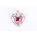 A yellow gold, diamond, and synthetic ruby pendantthe heart-shaped mount inset with mixed baguette-
