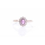 A 9ct yellow gold, diamond and pink sapphire cluster ringsize L 1/2, 1.2 grams.