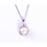 An 18ct white gold, diamond and pearl pendant, the white pearl approximately 7 mm diameter, within a