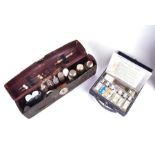 A late 19th century leather cased medical case by Brady & Martin with glass lidded bottles,