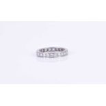 A diamond eternity ringset with 23 round brilliant-cut diamonds, in white metal mount (likely