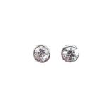 A pair of 18ct white gold single stone diamond stud earrings with no butterflies. Diamonds of H