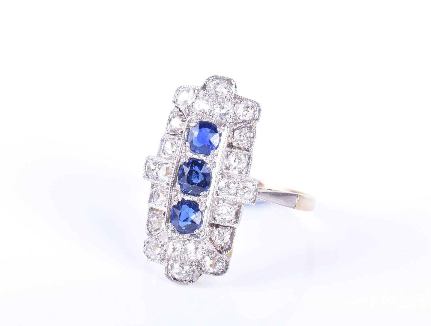 An Art Deco diamond and sapphire cocktail ringthe shaped rectangular panel mount centred north to - Image 2 of 4