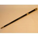 A Victorian conductors ebonised baton, with white metal mounts embossed with tight foliate