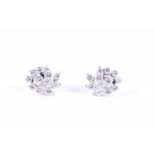A pair of diamond swirl cluster earringsset with round brilliant-cut diamonds of approximately 0.