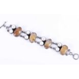 A silver, citrine, and blister pearl braceletthe segmnets set with alternating rough faceted