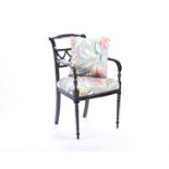 A 19th century Regency style armchair, with lattice work back and upholstered in a floral fabric