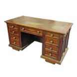 A mahogany pedestal desk, the green leather top over three frieze drawers, and three frieze