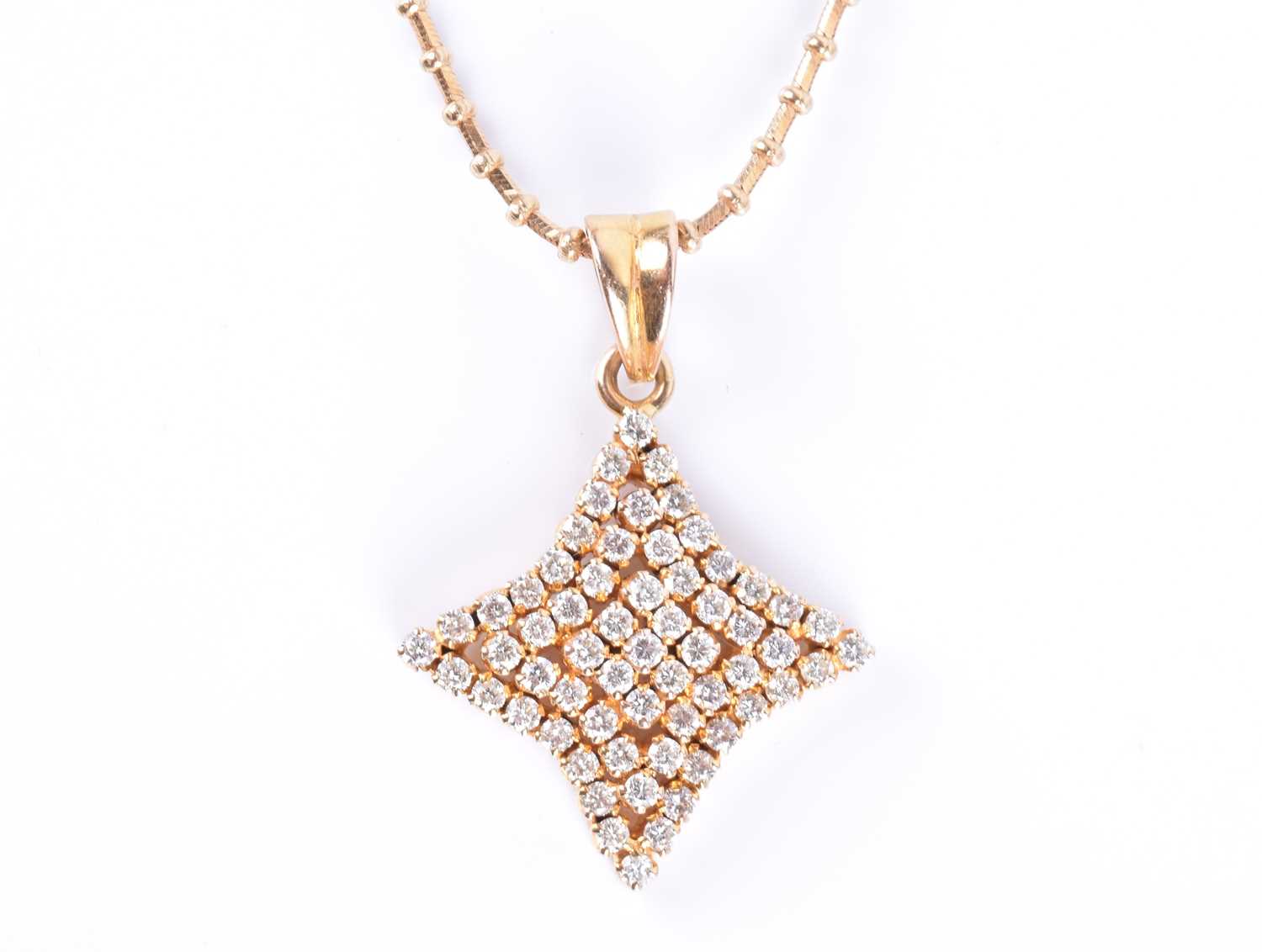 An 18ct yellow gold and diamond pendantin the shape of a four-pointed star, set with round - Image 2 of 5
