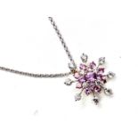 An 18ct two colour gold, pink sapphire and diamond pendant on an 18ct white gold trace chain, set