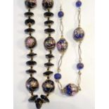 Two Venetian 'Wedding Cake' Murano glass necklaces, the blue necklace with gilt metal links, each