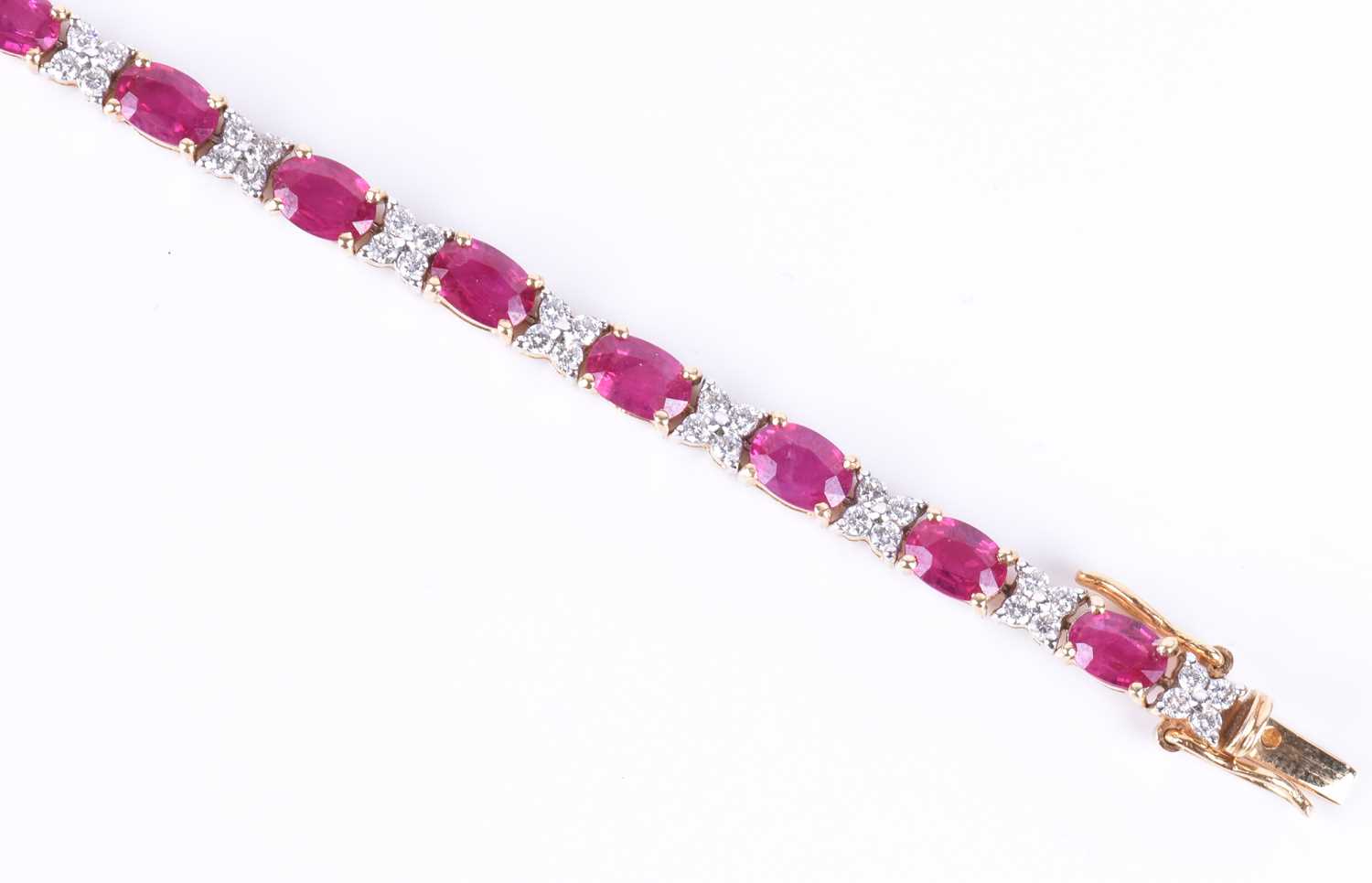 A fine 18ct yellow gold, diamond, and ruby line braceletset with nineteen mixed oval-cut rubies - Image 3 of 5