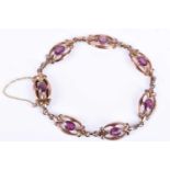 A Victorian 9ct rose gold and almandine garnet braceletthe stylised openwork links each inset with