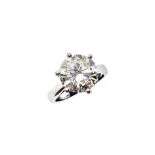 A platinum single stone diamond ring, claw set brilliant cut diamonds of L/M colour (tinted white)