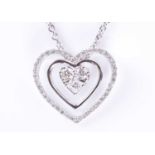 A diamond-set heart-shaped pendantcentred with two round-brilliant cut and a princess-cut diamond (