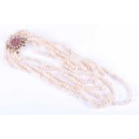 An impressive five strand Keshi pearl necklace, of graduated rows, fastened with a yellow metal,
