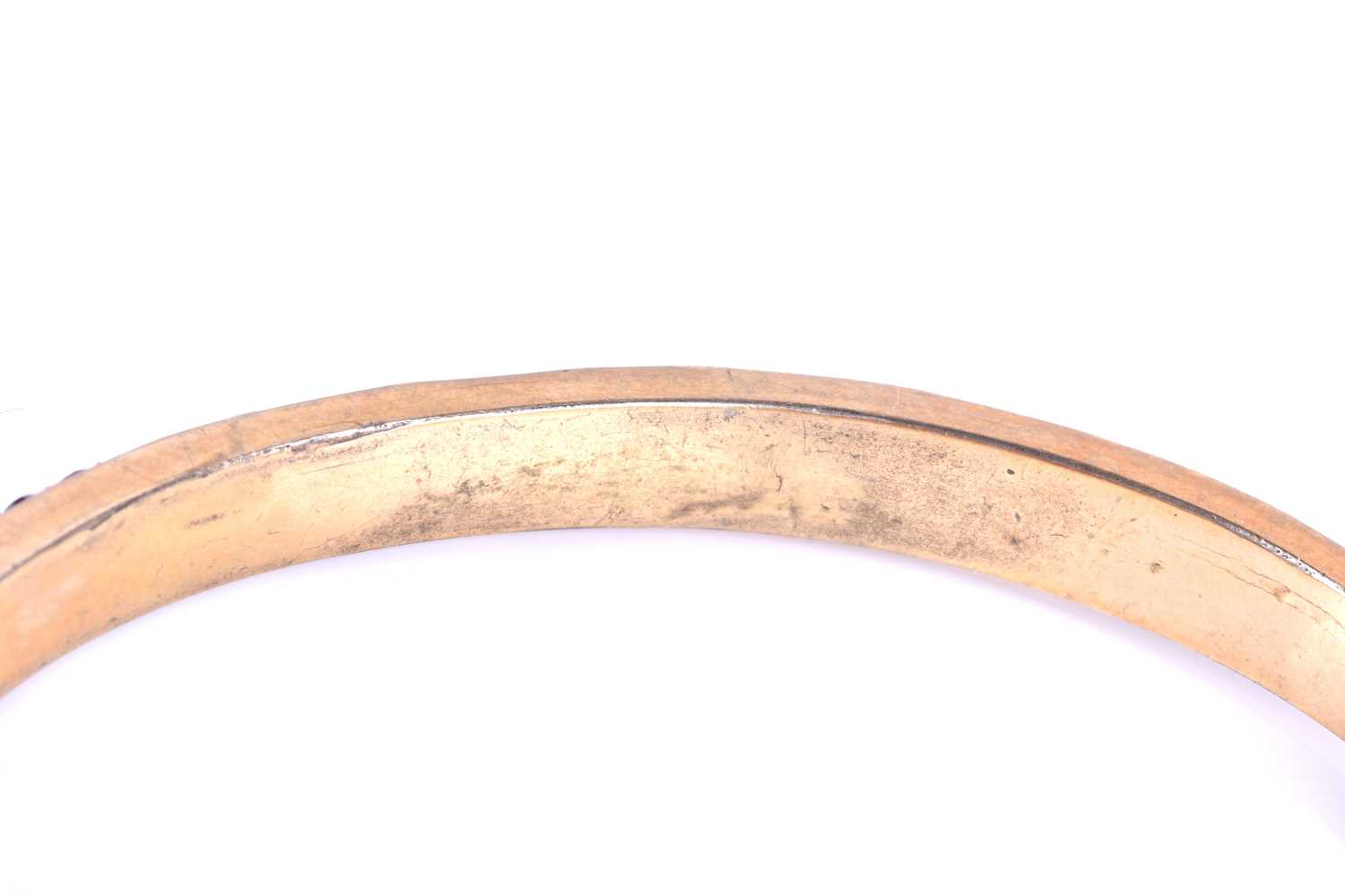 A late Victorian garnet bracelet, the gilt metal hinged bangle set with five collet-set rose-cut - Image 4 of 8