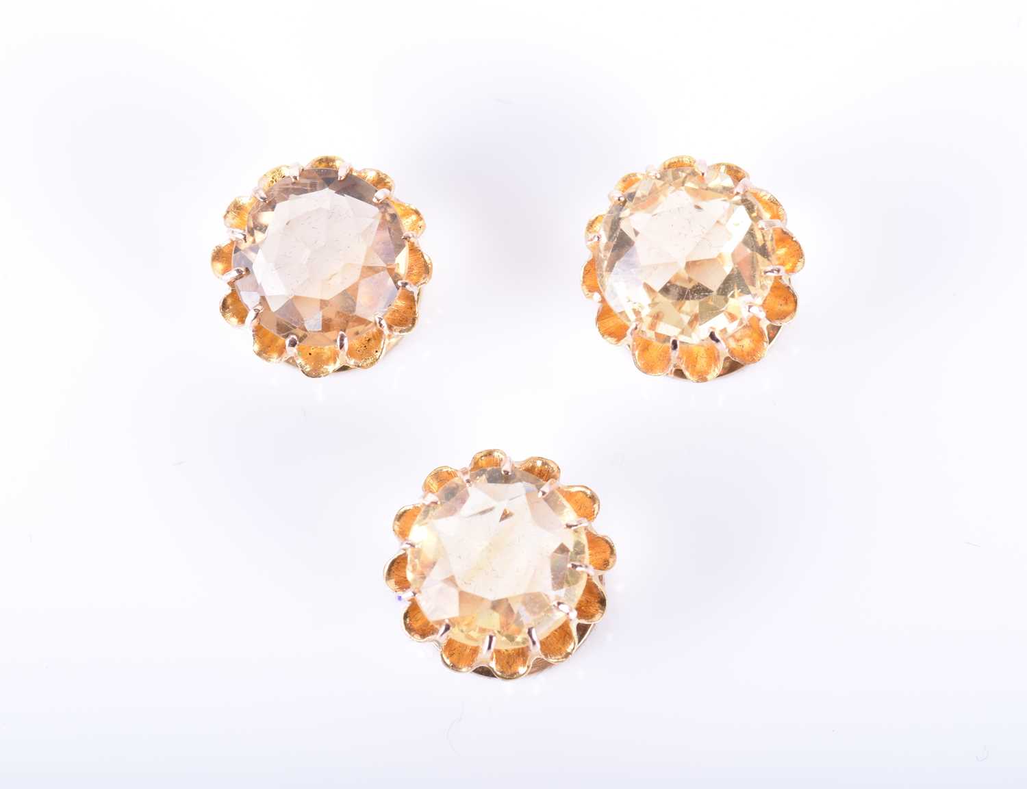 A set of three late 19th / early 20th century yellow gold and citrine buttonseach set with a mixed