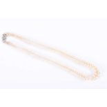 A double strand cultured pearl necklacefastened with a 9ct white gold and diamond accent clasp, 42