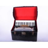 An Italian Settimio Soprani piano accordian, mid 20th century, in Scotti of Milan hard shell