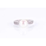 An 18ct white gold, diamond, and pearl ringset with a white cultured pearl approximately 8 mm