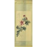 A Chinese hanging scroll, after Zhang Daqian (1899 - 1983), painted with blossoming peonies, with