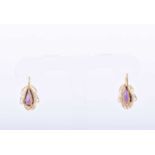 A pair of 18ct yellow gold and amethyst earringseach set with a mixed pear-cut amethyst within a
