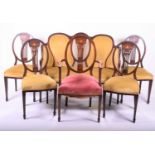An Edwardian suite of parlour furniture, comprising settee, armchair and four dining chairs, with