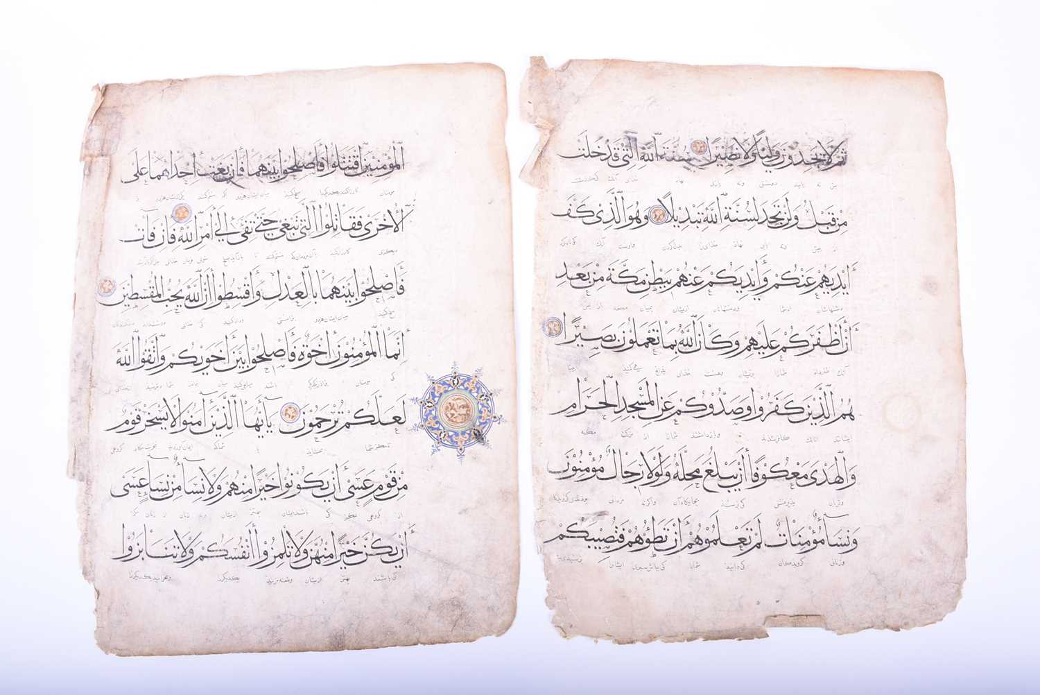 Two leaves of Persian script, 18th century, each with illuminated roundels, 40.5cm x 31cmCondition - Image 3 of 18