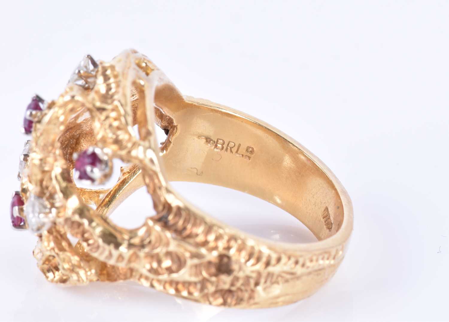 An unusual 1960s 18ct yellow gold, diamond, and ruby ringof Modernist design, the textured mount - Image 7 of 7