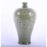 A Chinese celadon ground meiping vase, the shoulder with lotus flower and scroll band above Rui head