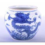 A Chinese blue and white jardiniere, decorated with opposing dragons facing a flaming pearl