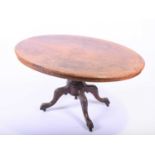 A Victorian walnut veneered loo tablewith quarter veneered and boxwood strung top centering on a