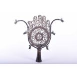 An Indian Deccan cut brass and copper calligraphic Alam finial, the protective hand with cut