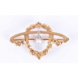 A late 19th / early 20th century yellow gold, diamond, and pearl broochof wreathed foliate design,