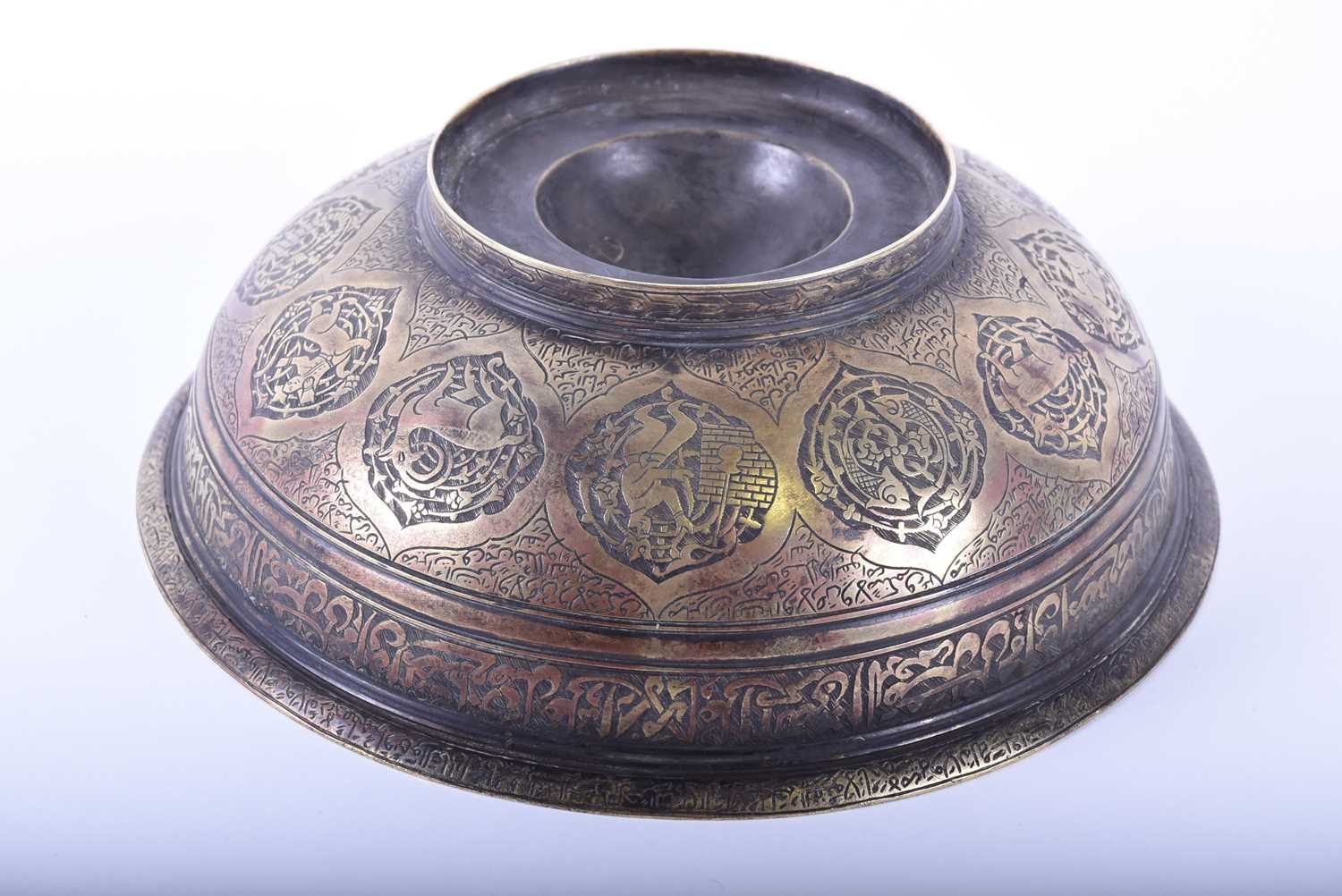 A Persian cast bronze calligraphic bowl, the interior with central raised boss, pierced at the - Image 2 of 5