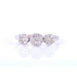 A white metal and diamond cluster ringset with three clusters of round brilliant-cut diamonds,