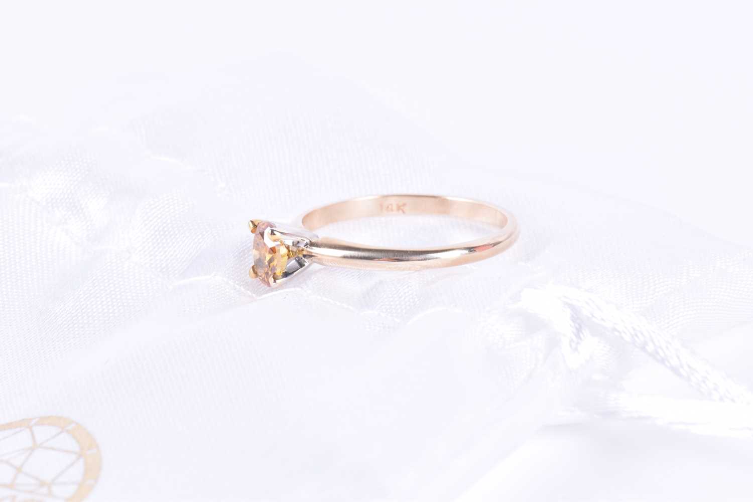 A 14k yellow gold and solitaire diamond ringset with a 0.45 carat fancy deep orange mixed oval-cut - Image 4 of 4