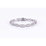 A white gold and diamond Art Deco braceletthe chamfered rectangular panels inset with round