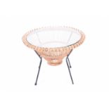 A Franco Albini glass topped wicker table, mid 20th century, 50cm high, 68cm diameterCondition