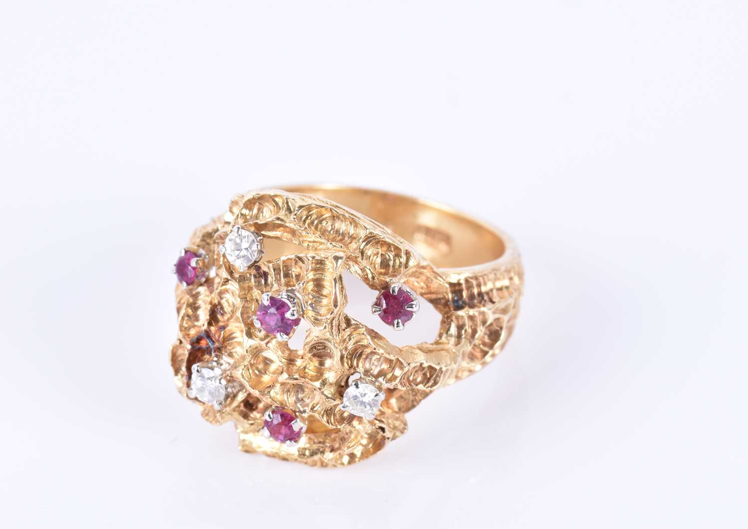 An unusual 1960s 18ct yellow gold, diamond, and ruby ringof Modernist design, the textured mount - Image 4 of 7