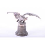 A Louis Lejeune silver plated car mascot, early 20th century, modelled as an eagle with outstretched
