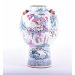 A Chinese Famille Rose vase, mid 19th century, the shoulders with lion mask handles, the spherical