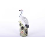 A Chinese porcelain model of a Crane, 19th century, the body with painted and incised decoration,