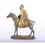 A gilt bronze equestrian figure, modelled as a wealthy Arab gentleman looking to the left whilst