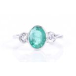 A diamond and emerald ringthe collet-set mixed-cut emerald of approximately1.40 carats, flanked with