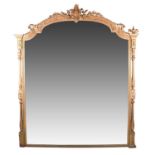 A large 19th century gilt framed mirror, with foliate pediment flanked by urn finials, with